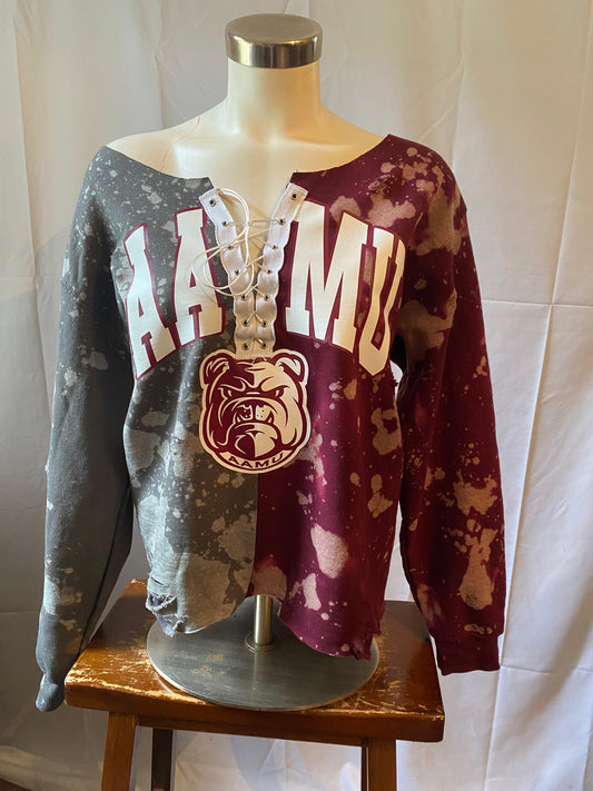 Two distressed sweatshirts on a mannequin with 'HAWAII' and 'BULLDOGS' text against a white background.