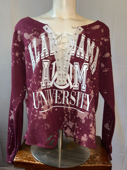 Maroon long-sleeve shirt with 'Alabama A&M University' text on a mannequin.