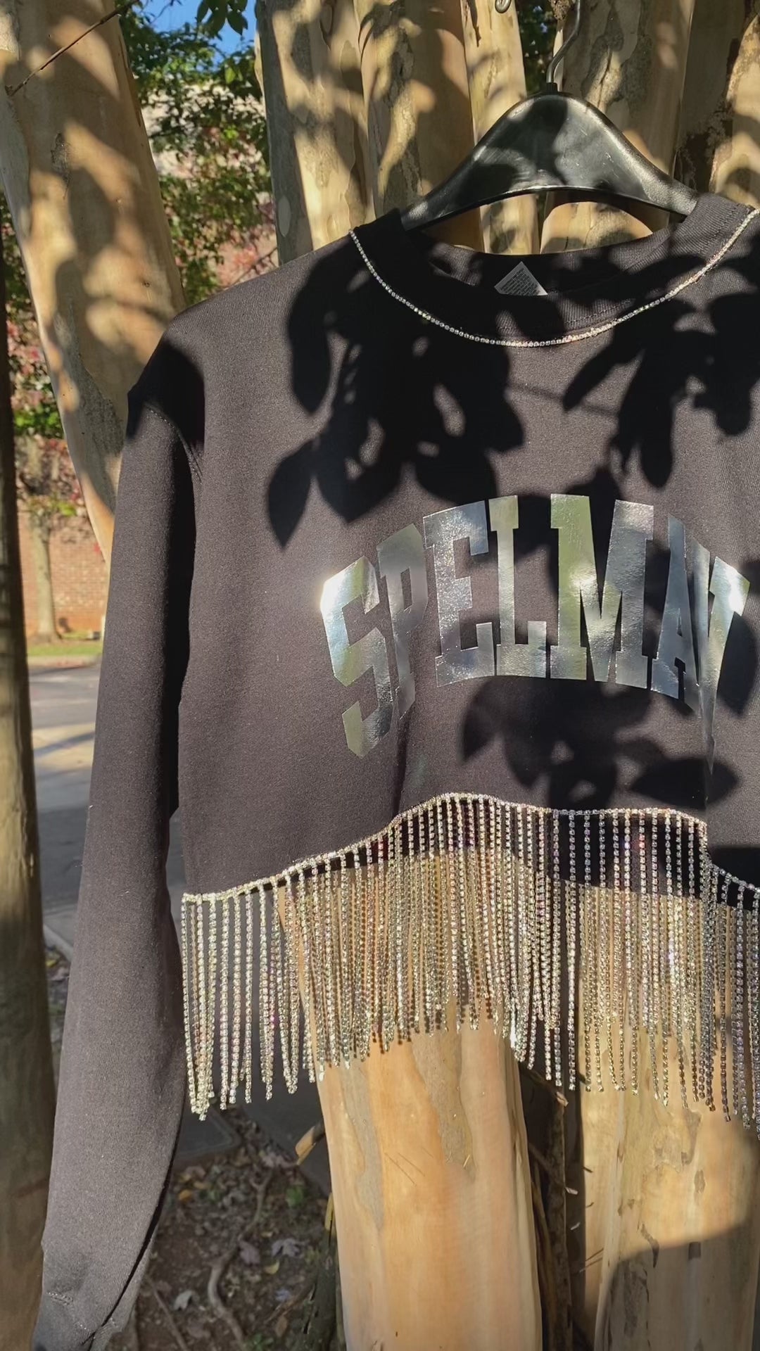 Black cropped Spelman sweatshirt with rhinestone fringe and rhinestone trim