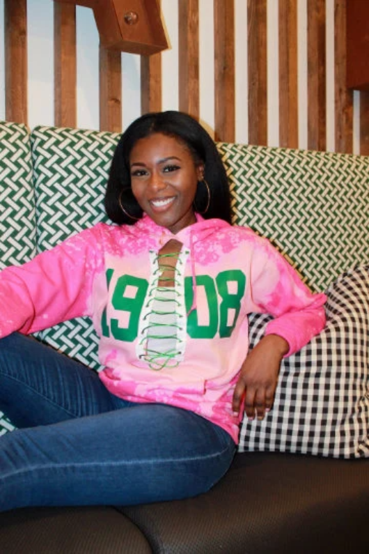 Green top pink sweatshirt