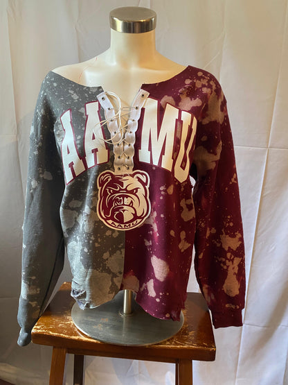 Two distressed sweatshirts on a mannequin with 'HAWAII' and 'BULLDOGS' text against a white background.
