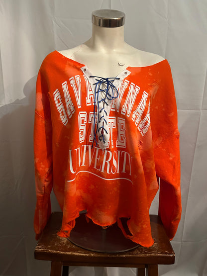 Orange sweatshirt with 'Cavalier State University' text on a mannequin against a white background